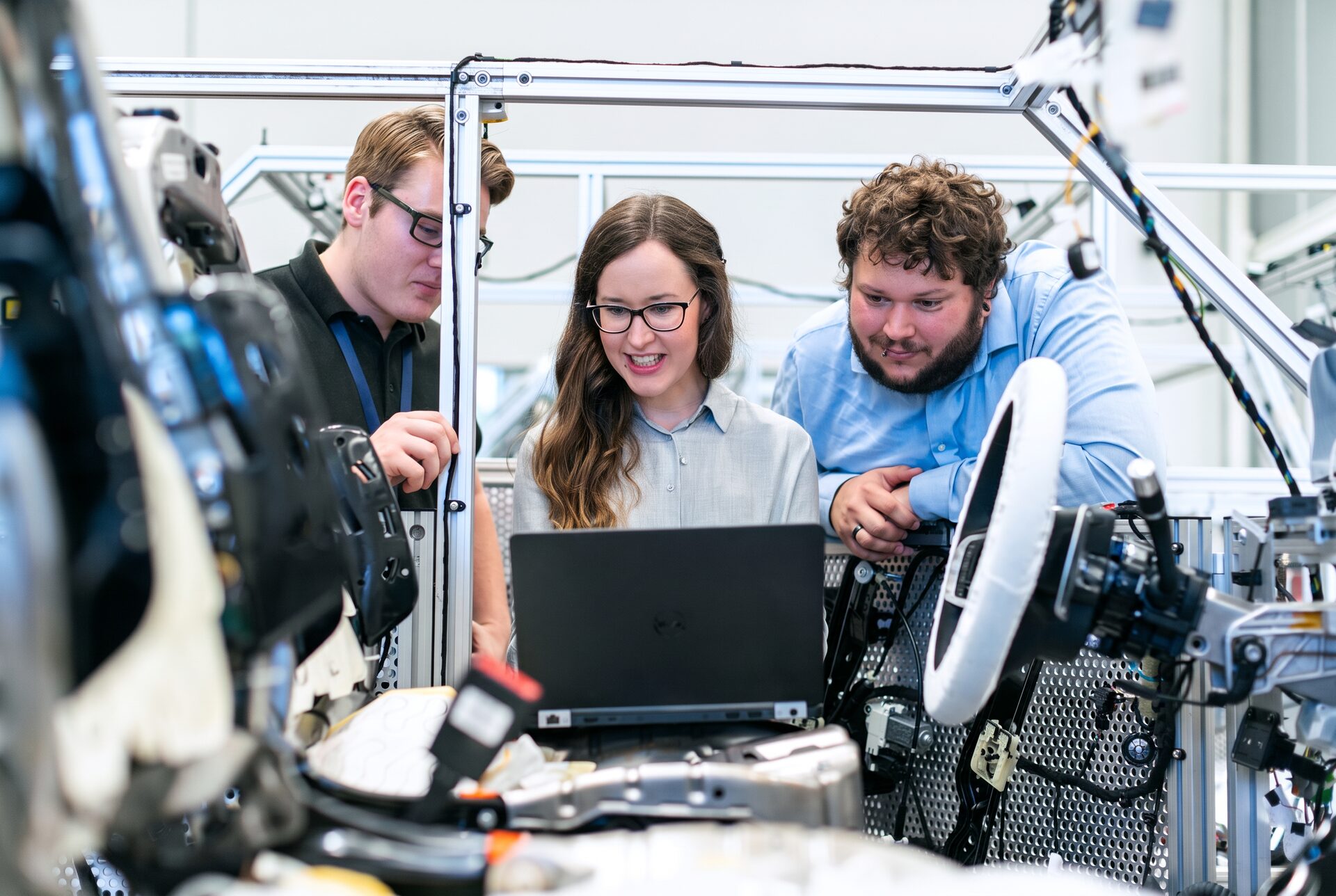 PartsMaker AI engineers reviewing drawings together in the workshop